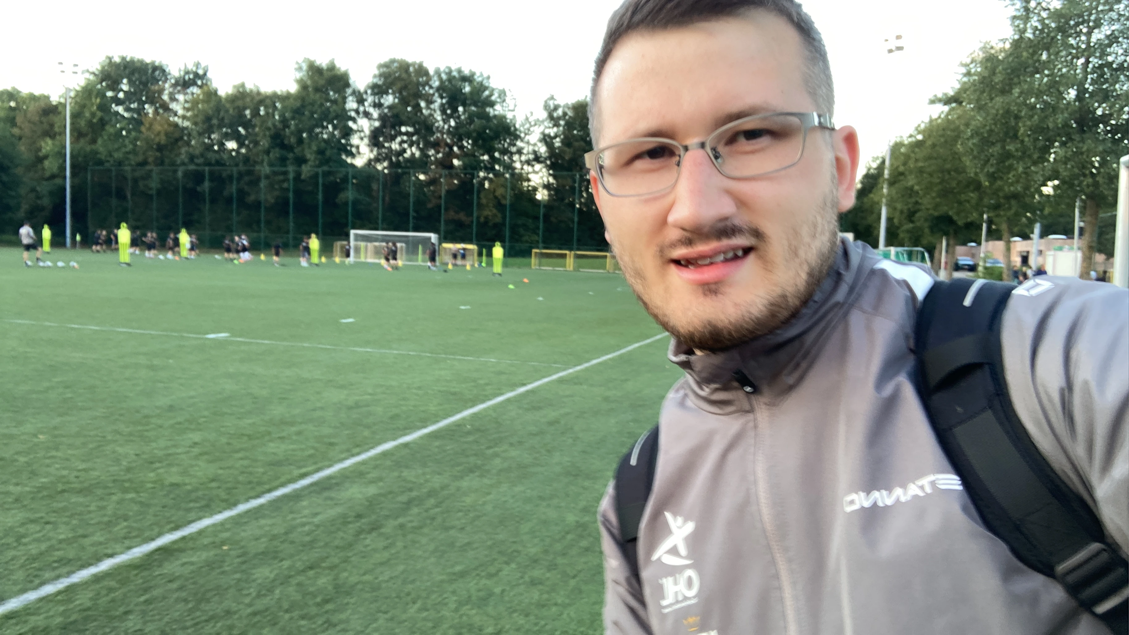 Coach leaving field after youth football session